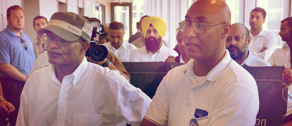 Drivers seated at a historical Teamster Taxi meeting